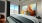 Liberty Duet Apartments, Salt Lake City, Utah, bedroom with large window, ceiling fan and colored artwork