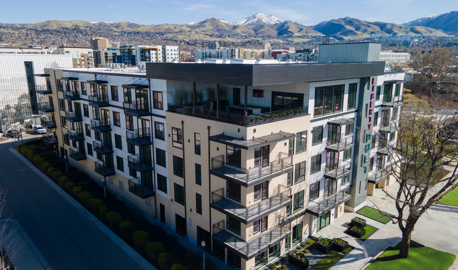 Liberty Duet Apartments, Salt Lake City, Utah, 2 Bedroom Apartments, Drone image from Soutwest side with Wasatch Mountains in background.