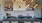 Liberty Duet Apartments, Salt Lake City, Utah, Rooftop Lounge, kitchen area, microwave, sink, cooktop, long table for group seating, dishwasher, overhead decorative gold lights. 