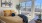 Liberty Duet Apartments, Salt Lake City, Utah, bedroom with large window, ceiling fan, yellow bedding and pillows colored artwork