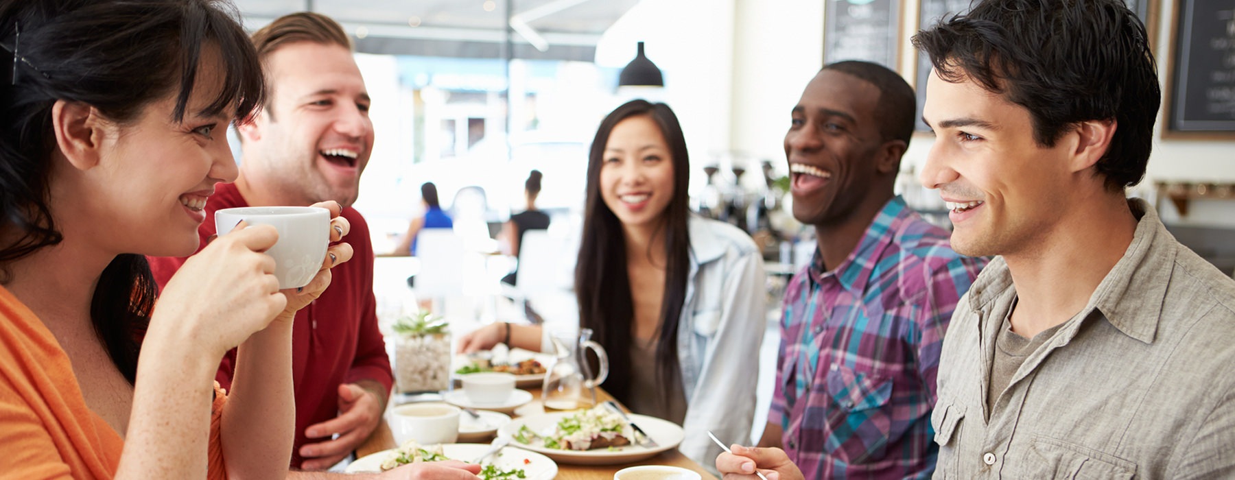 people laughing and drinking coffee